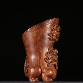 A Huanghuali beast pattern cup