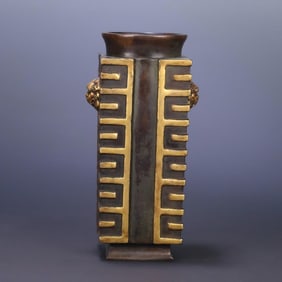 A copper-gilt double lion's ear bottle made in the Ming Dynasty,