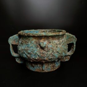 A piece of Shang and Zhou bronze dragon ear basin