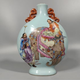 A Qing Dynasty elephant riding figure turquoise green moon holding vase