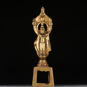 A copper gilt bench Buddha