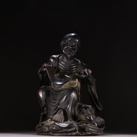 A Qing Dynasty small-leaved rosewood arhat