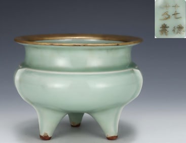 A Song Dynasty Longquan powder celadon three-legged furnace