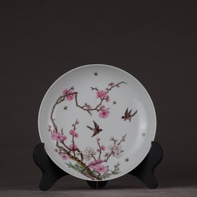 A Qing Qianlong carmine pastel flower and bird plate