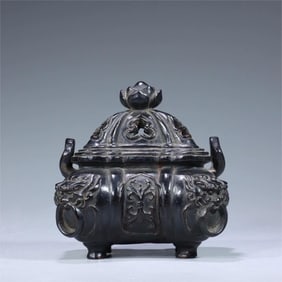 A Qing Dynasty rosewood carved lion's ear small piano stove