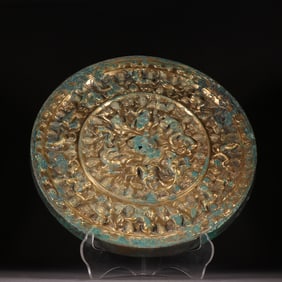 A large bronze mirror of gilded sea beast grapes