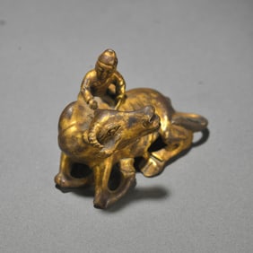 A piece of Qing Dynasty Copper gilt cowherd boy study paperweight