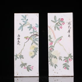 A pair of pastel flower and bird hat tubes