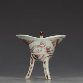 A Yuan Dynasty glazed red phoenix pattern three-legged cup