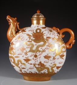 A Qing Qianlong alum red gold-painted Kowloon teapot