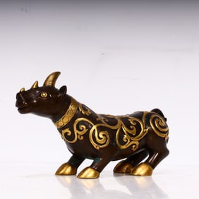 A Qing Dynasty copper rhinoceros ornament