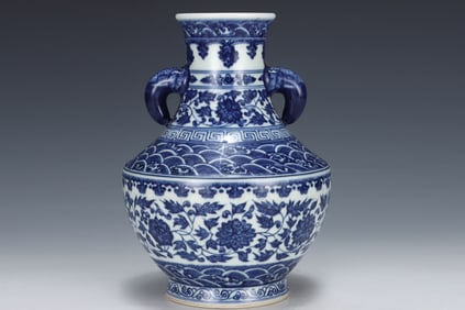 A Qing Dynasty Qianlong blue and white entwined lotus pattern amphora elephant ear statue