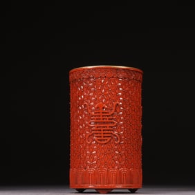 A Qing Dynasty porcelain tire engraved with a longevity pattern pen holder