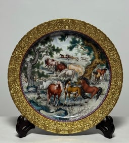A Qing Qianlong model enamel carved gold-painted Fushou Lianlian horse herding plate