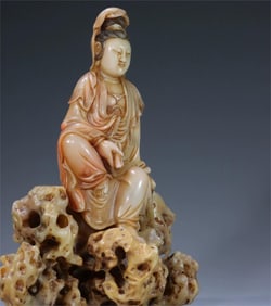 A piece of Shoushan stone carving jade Xuan from the Qing Dynasty holds the scriptures and Guanyin