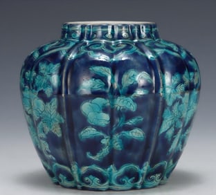 A Ming Dynasty Xuande blue background green melon edge three cans