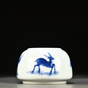 A blue and white water bowl