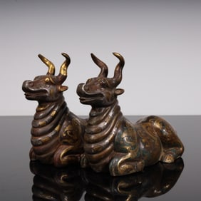 A piece of copper cuo gold and silver sheep carving (a pair).