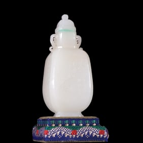 A Qing Dynasty Hetian jade plum orchid bamboo chrysanthemum bottle