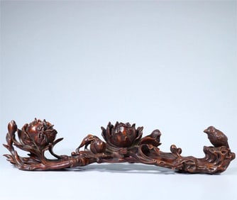 A Qing Dynasty boxwood magpie peony pattern ruyi ornament
