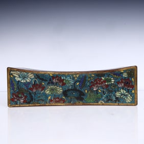 A Qing Dynasty cloisonné painted lotus pillow