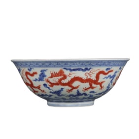 A large bowl of blue and white alum red five dragons wearing the sky