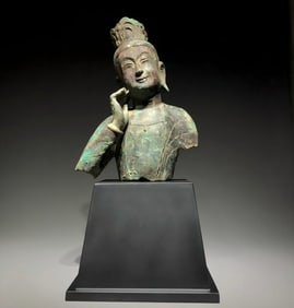 A bronze bust statue of a thinking Bodhisattva
