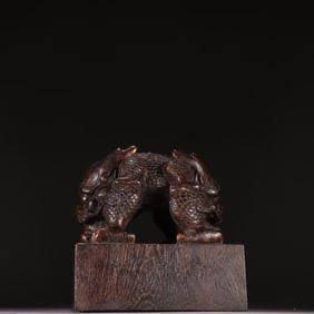 A Qing Dynasty agarwood dragon button seal