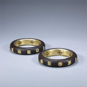 A pair of exquisite honey-scented Qi Nan wrapped silver gilt bracelets