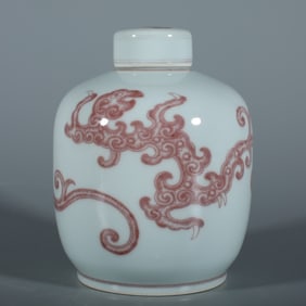 A Qing Dynasty Yongzheng glazed red Kui dragon pattern lid jar