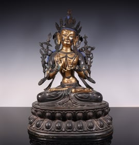 A piece of copper-gilt green Tara