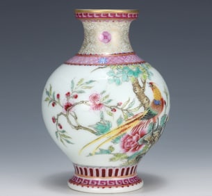 A Qing Yongzheng enamel flower and bird vase