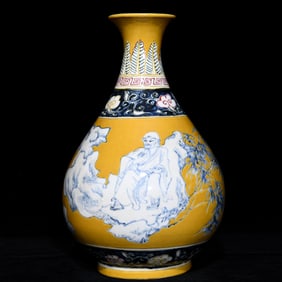 A bright yellow blue and white three-color Arhat pattern jade pot spring vase
