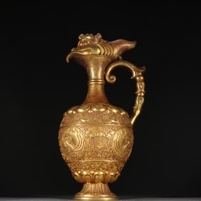 A Tang copper gilt phoenix head pot