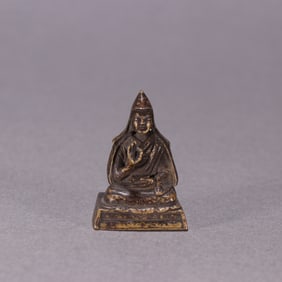 A Qing Dynasty bronze fetal guru Buddha