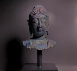 A bronze bust of Buddha