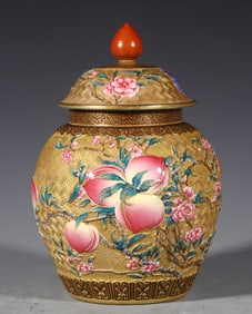 A Qing Qianlong carved nine peach pure gold tea jar