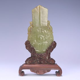 A Hetian topaz gluttonous poetry jade ornament
