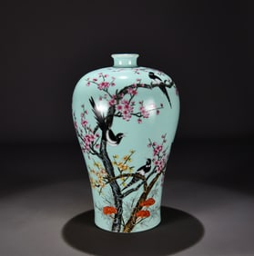 A Qing Qianlong celadon pastel spring plum annunciation plum bottle