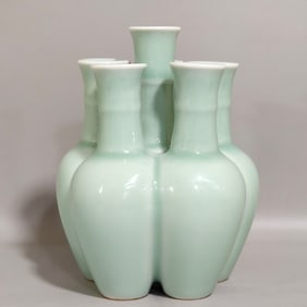A Qing Dynasty Qianlong pink celadon five-tube bottle