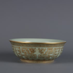 A Qing Dao Light-year bean celadon carved with gold and Kui Feng pattern bowl