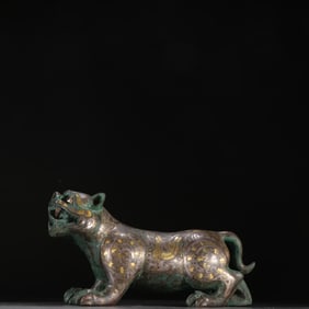A Han copper file gold and silver inlaid turquoise tiger ornament