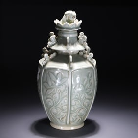 A Song celadon carved vase with a lid