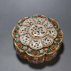 A silver-gilt filigree inlaid Hetian jade fired blue lid box