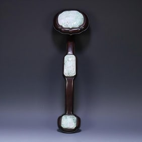 A Qing rosewood inlaid jadeite entwined floral pattern ruyi ornament