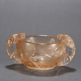 A clear crystal dragon ear cup