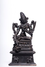 A seated statue of Tara in the Qing Dynasty alloy patina