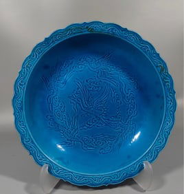A peacock blue carved crane plate from the Qing Dynasty