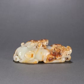 A carving of a Han Hetian jade mother beast