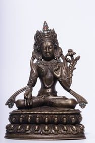 A seated statue of Tara in copper gilt silver and white in the Qing Dynasty